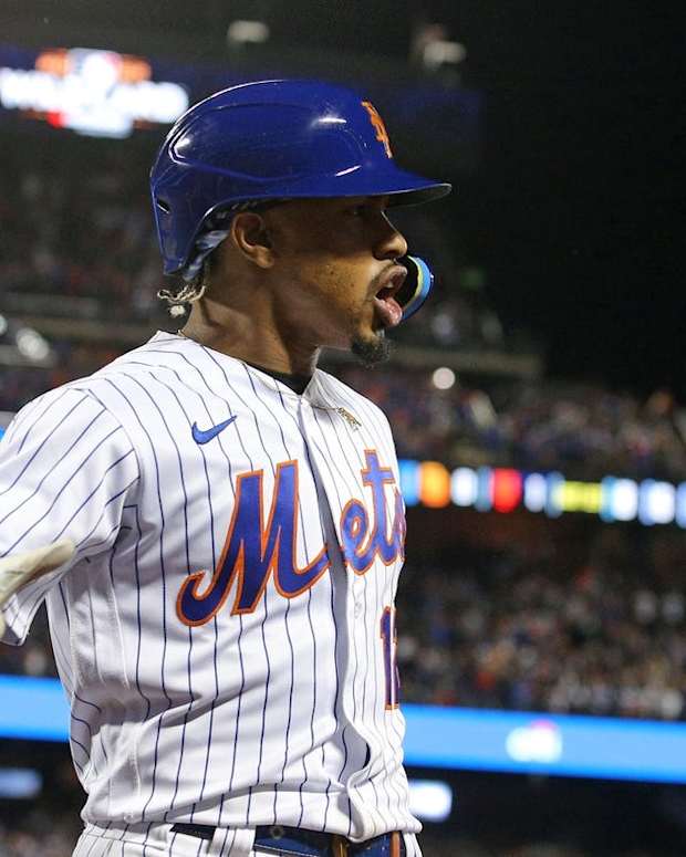 Oct 8, 2022; New York City, New York, USA; New York Mets shortstop Francisco Lindor (12) reacts after hitting a solo home run in the first inning during game two of the Wild Card series against the San Diego Padres for the 2022 MLB Playoffs at Citi Field. Mandatory Credit: Brad Penner-USA TODAY Sports